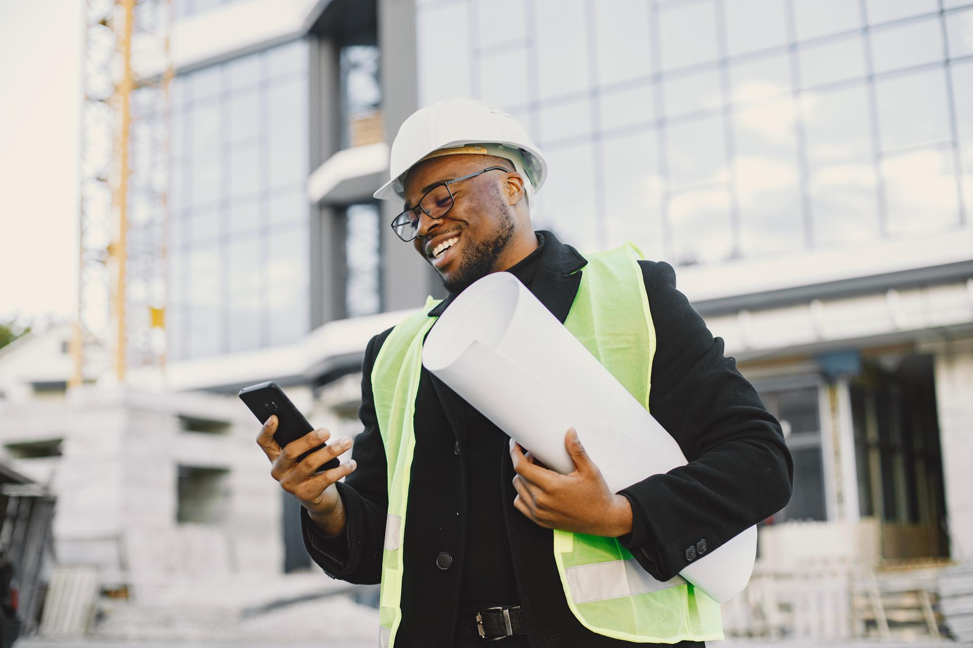 https://atriumhomes.ng/wp-content/uploads/2024/02/young-black-race-man-with-blueprint-stading-near-glass-building.jpg
